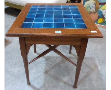 An oak Arts and Crafts centre table with tile inset top. 24' wide