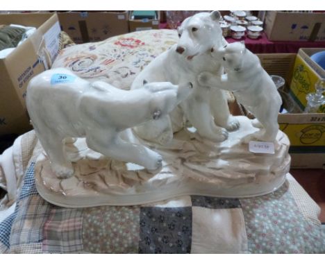 A ceramic group of three polar bears. Japanese 20th century. 18' wide