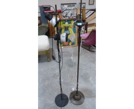 A brass lamp standard and another in 1960s style