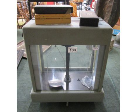 Cased scientific scales with weights