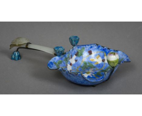 A Chinese carved jade handled enamel brush washer
The main body decorated with floral scroll work.  18 cm long.  CONDITION RE