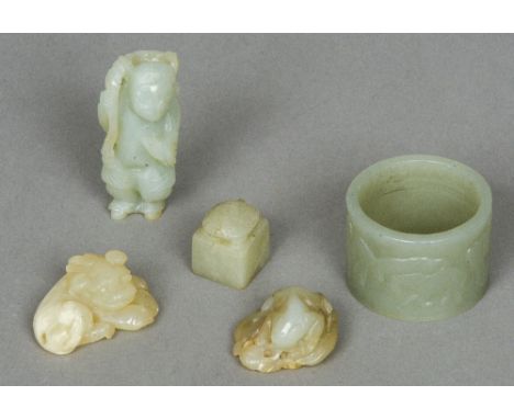 A small Chinese carved jade figure
Together with four other various jade pieces.  The former 6.25 cm high.  (5) CONDITION REP