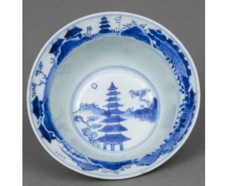 A Chinese blue and white porcelain bowl
Decorated with figures in a continuous landscape, the interior decorated with a pavil
