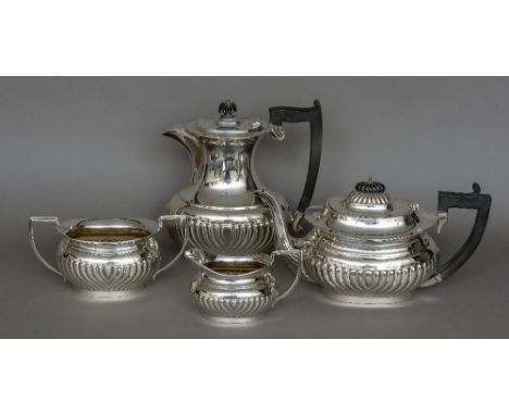 A George V silver four piece tea service, hallmarked Birmingham 1930, maker's mark of William Adams Ltd
Each piece with gadro