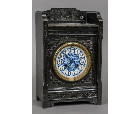 A Victorian Aesthetic mantle clock 
The blue painted enamelled dial with Arabic numerals and gong striking Japy Freres barrel