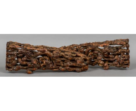 A pair of Chinese carved wooden mounts
Each carved with a five clawed dragon chasing a flaming pearl through clouds.  63 cm w