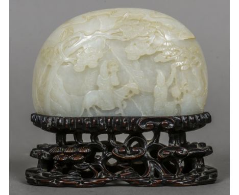 A 19th century Chinese carved mutton fat jade plaque
Of domed bowed form, decorated with a figure on horseback and his attend