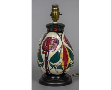 A modern Moorcroft pottery table lamp
Decorated with birds amongst stylised flowers.  28 cm high. CONDITION REPORTS: Generall