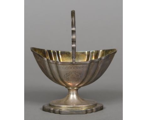 A William IV silver sugar basket, hallmarked London 1835, maker's mark of RC
With loop handle above the shaped basin with twi