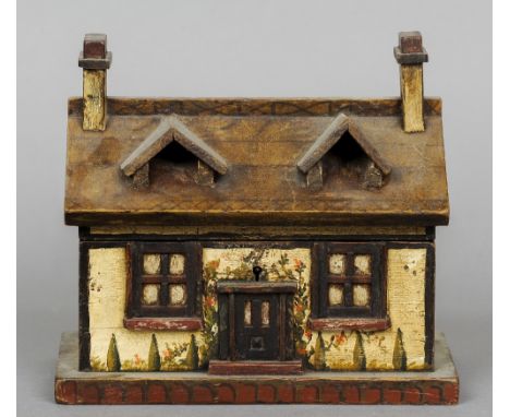 A Victorian painted tea caddy
Formed as a cottage.  23 cm wide. CONDITION REPORTS: Overall good, some minor paint wear/loss, 