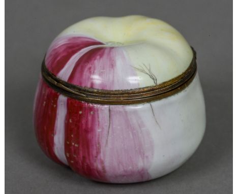 A 19th century enamelled apple form snuff box
Of typical form.  4 cm high. CONDITION REPORTS: Generally in good condition, ex