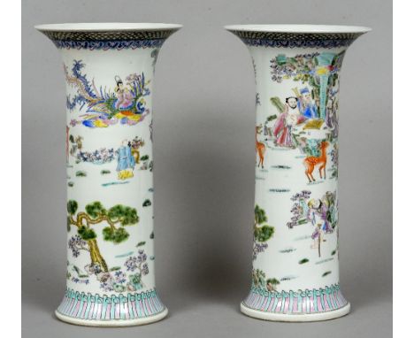 A pair of Chinese porcelain vases
Each decorated with figures and deer in a continuous landscape, blue painted six character 