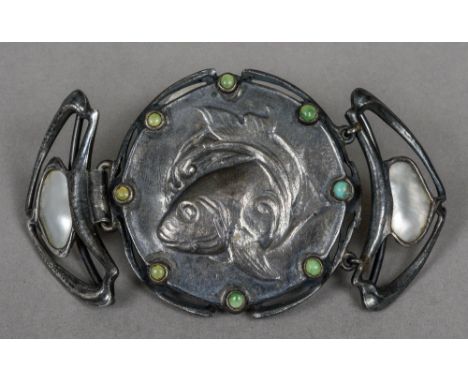 An Art Nouveau buckle
Mounted with mother-of-pearl and turquoise cabochons centred with a fish.  11 cm wide.  CONDITION REPOR