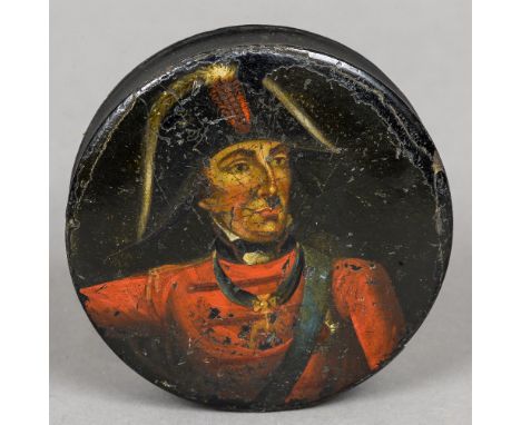 A 19th century papier mache snuff box
Of circular section, the cover decorated with a portrait of the Duke of Wellington.  10