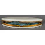 A 19th ivory patch box Of navette form, with a secret catch, the lid interior set with a mirror. 9.