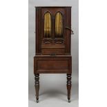 A 19th century barrel organ The hinged rectangular top above the gilt decorated typed front,