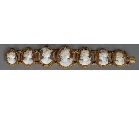 A 19th century unmarked gold cameo bracelet
Set with seven classically carved portrait busts.  18 cm wide.  CONDITION REPORTS