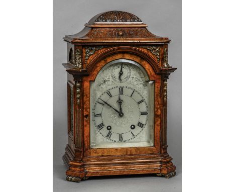 A Victorian walnut cased eight day striking bracket clock
The silvered 6" arched dial with Roman numerals, subsidiary slow/fa