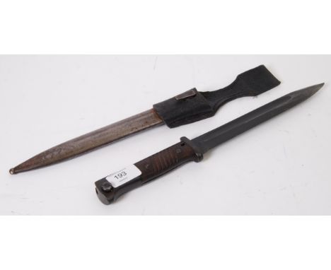 BAYONET: An original K-98 Mauser rifle bayonet. 38cm long, with leather holster and original scabbard.

NOTE: From an impress