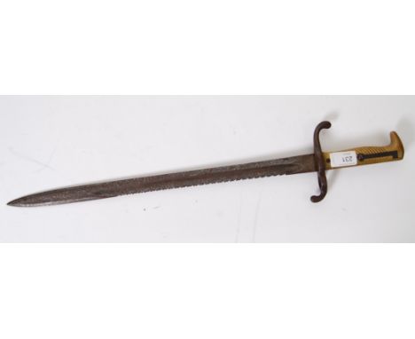 BAYONET: A German sword bayonet model 1871, having fullered blade coming to a spear point. Sawback bayonet, issued to NCO's. 