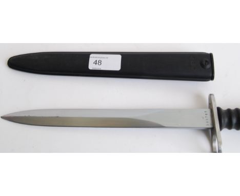 BAYONET: A 20th century Dutch Army bayonet dagger complete with composite scabbard. The shaped blade marked F+W with addition