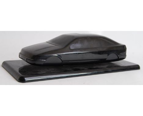 CONCEPT CAR: An original either Ford Sierra Cosworth or Vauxhall Calibra concept car design statue piece. Made of black acryl