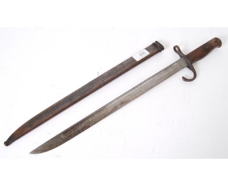 A SECOND WORLD WAR JAPANESE ARISAKA BAYONET ;bearing arsenal mark at the ricasso, in its steel scabbard. c1897. 51cm long

NO