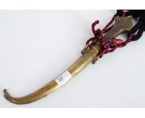 DAGGER; An Indian brass curved blade dagger, with brass scabbard, and rope and braid strung handle. 