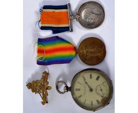 MEDAL GROUP; A good First World War WWI medal pair of Gnr 104848 H. Guy, Royal Artillery. Along with Guy's uniform cap badge 