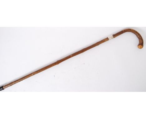 CANE: A First World War WWI interest hallmarked silver collared walking stick cane, the band engraved ' 1914 - 1919 '.