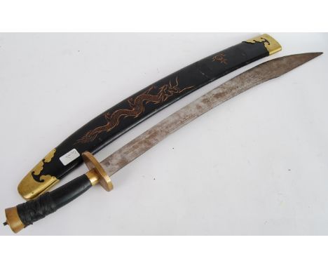 SWORD: A large Chinese oriental sword in original scabbard. 