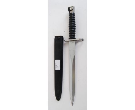 BAYONET: A 20th century Dutch Army bayonet dagger complete with composite scabbard. The shaped blade marked F+W with addition