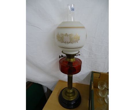Victorian oil lamp with cranberry glass font and later shade