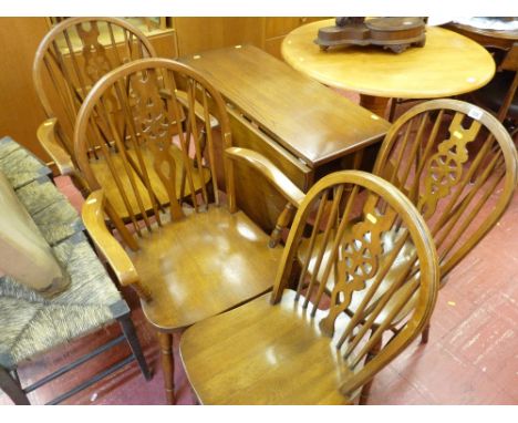 Twin flap gate leg dining table and four wheelback dining chairs