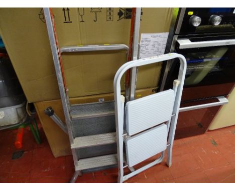 White two step ladder and a decorator's stepladder