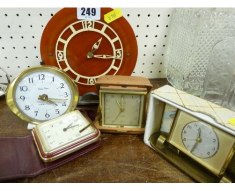 Art Deco bakelite and chrome mantel clock, two small alarm clocks and two travel clocks