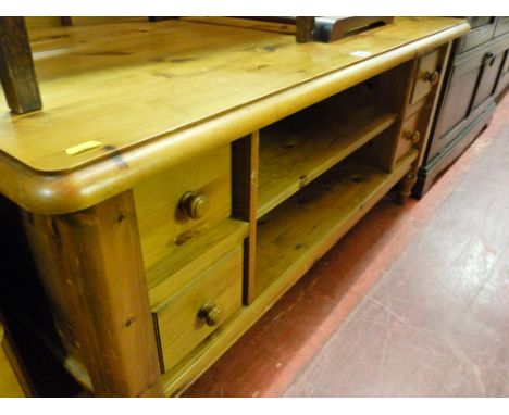 Pine coffee table with four drawers and centre shelf