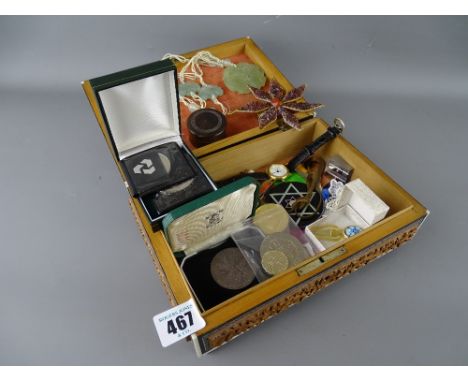 Vintage carved wooden box containing various collectable items including a jade necklace, coinage and other jewellery etc