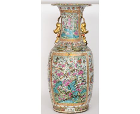 A 19th Century Chinese Canton enamel floor vase of baluster form with collar neck decorated with applied dogs below a petal e