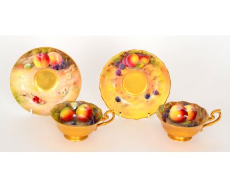 Two Royal Worcester fruit painted cabinet teacups and saucers, the first painted by Ayrton and Austin with apples, peaches an