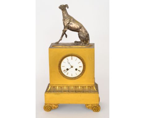 A 19th Century eight day strike gilt mantle clock, Roman numerals to a white enamelled dial above inverted acanthus leaf frie