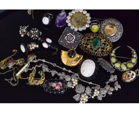 A parcel lot of costume jewellery to include a silver marcasite and faux pearl necklace and earrings set, cameo and jet suite