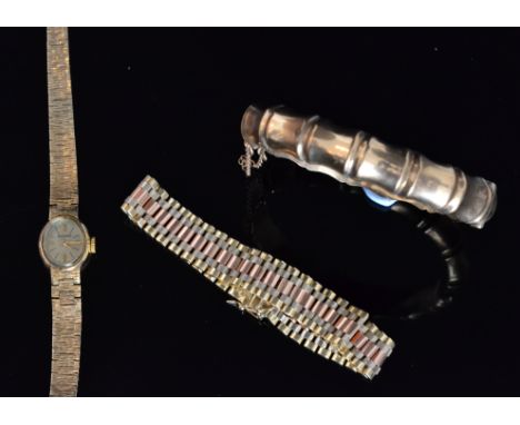 A 9ct brick link three tone flexible bracelet, together with a 1970s 9ct hinged bangle with bamboo design, both stamped, toge