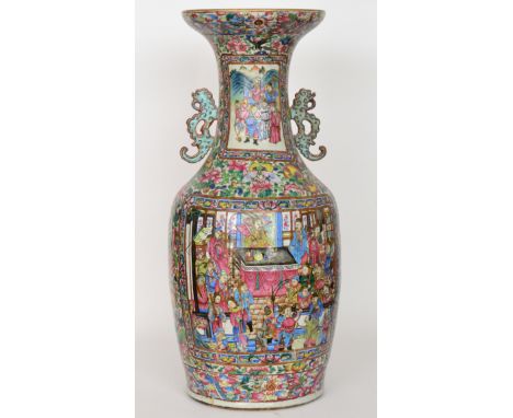 A 19th Century Chinese Canton enamel floor vase of baluster form with collar neck decorated with stylised bat handles below a
