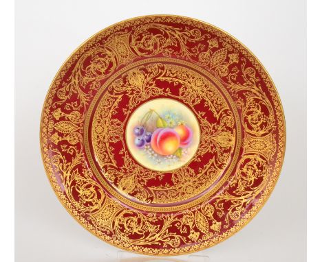 A 20th Century Royal Worcester cabinet plate decorated with a hand painted roundel by R. Price with peaches, cherries and str