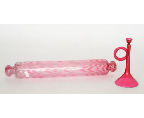 A 19th Century Nailsea type rolling pin decorated with pink and white loops over the clear ground, length 43cm, together with