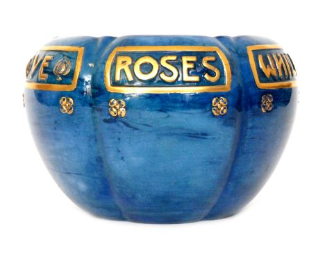 A 1920s Royal Worcester Sabrina Porcelain jardiniere, the lobed body with relief moulded verse 'While ye may gather ye roses'