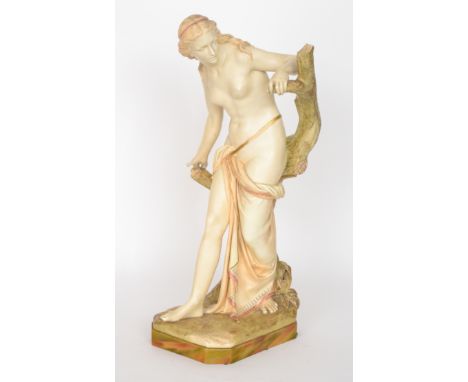 A large Royal Worcester figure of the Bather Surprised, after the original by Sir Thomas Brock, modelled as a scantly clad ma