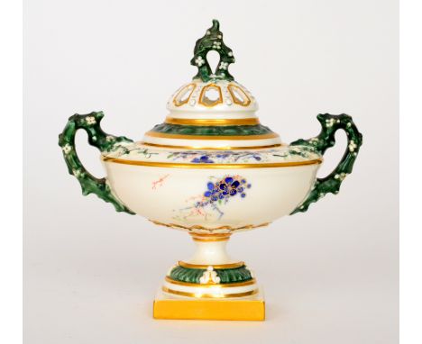 An early 20th Century Royal Worcester twin handled pot pourri in the Aesthetic style, the milk white body decorated with blue