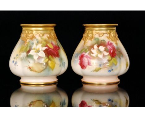A matched pair of Royal Worcester cache pots, each of lobed form and decorated with a white lily amidst roses and forget-me-n